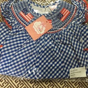 NWT still in bag smocked flag bishop dress. 6-9mos